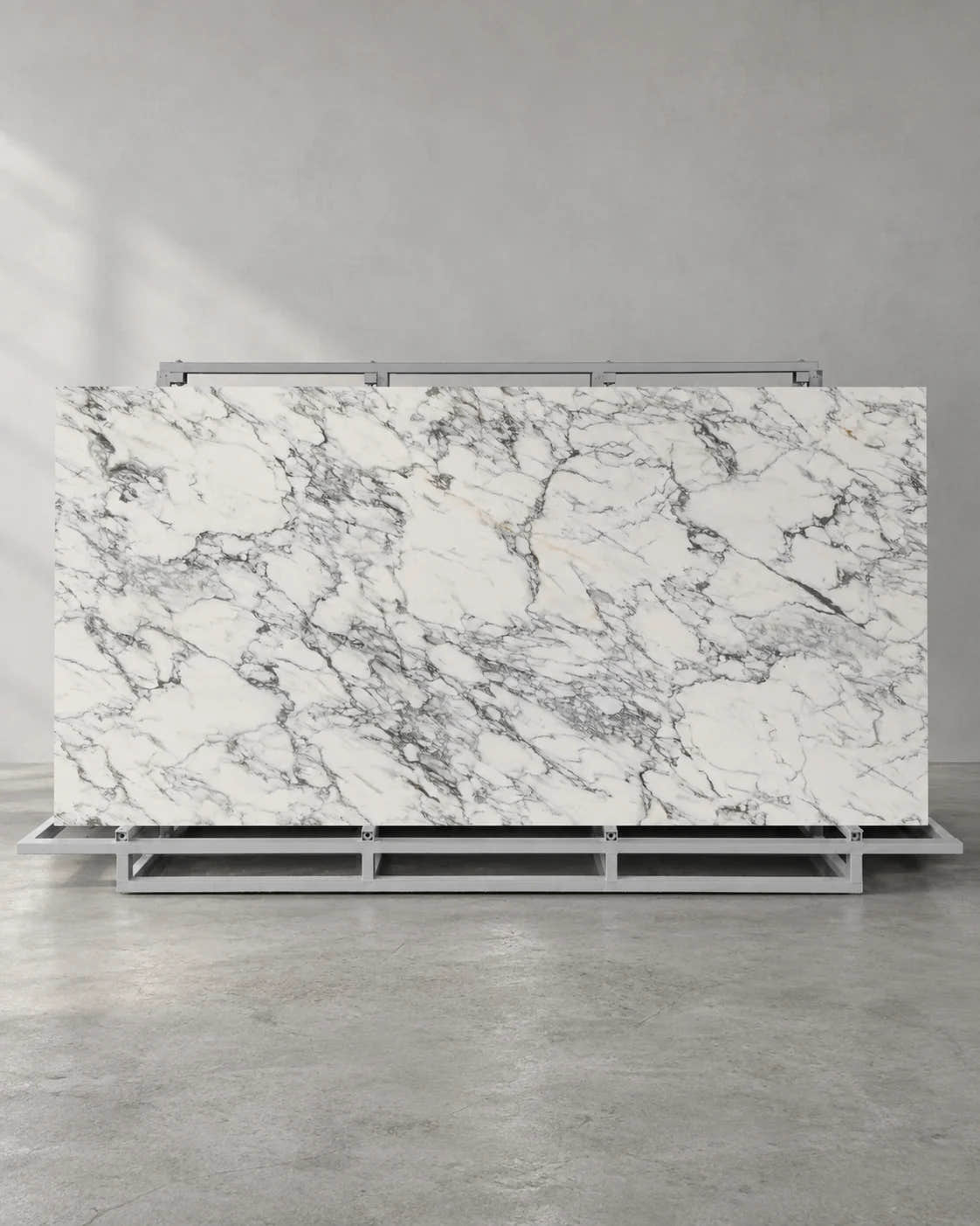 Balop white marble-look sintered stone slab on a complete A-frame in a showroom