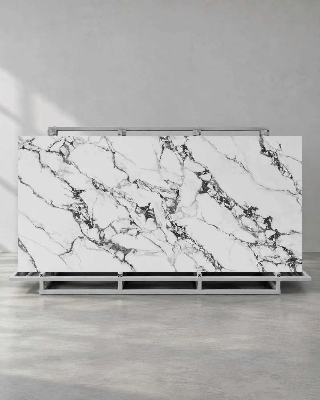 Bvlgari Black full sintered stone slab on an A-frame with white and charcoal breccia veining