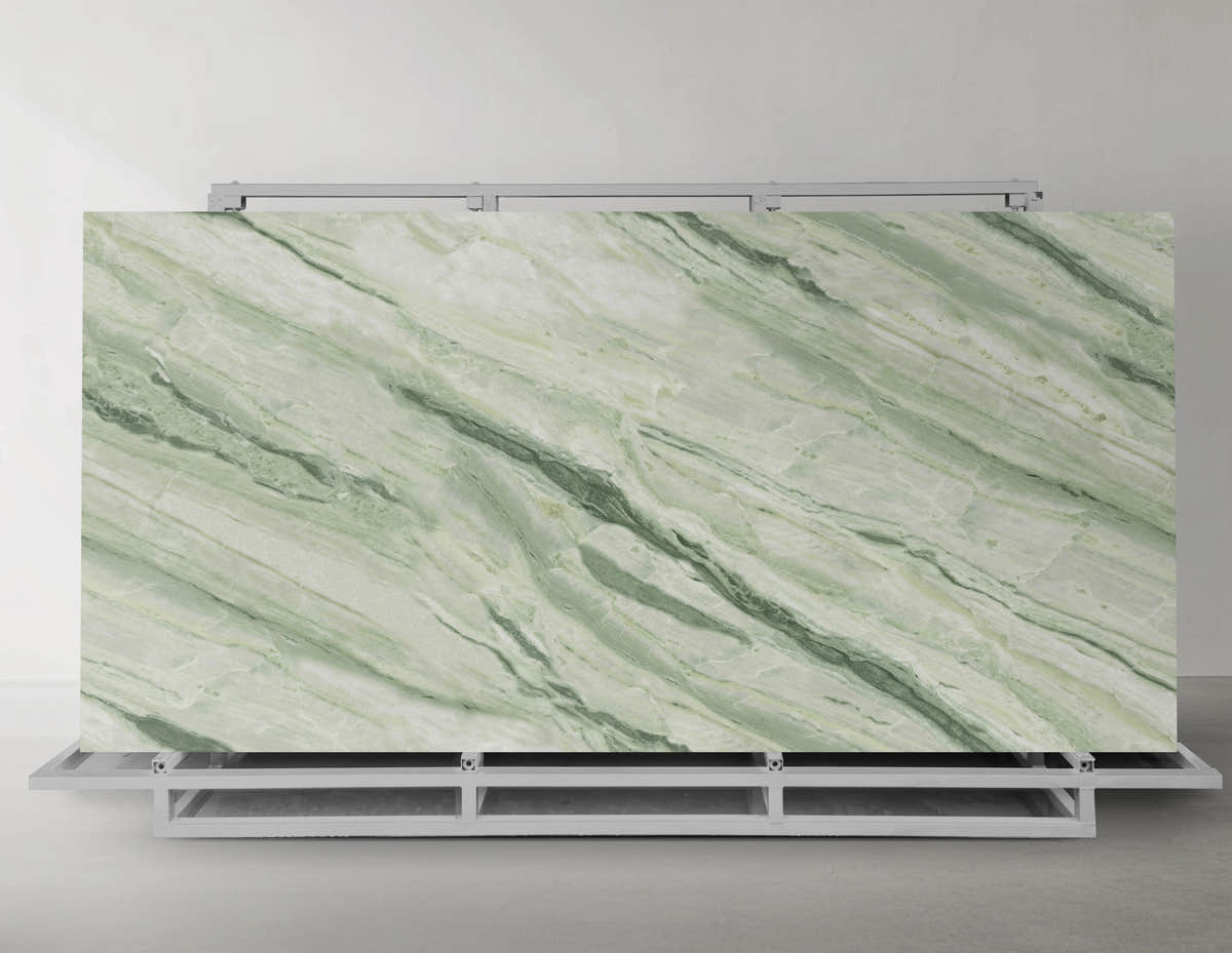 Celestial Jadeite green sintered stone slab displayed on a metal A-frame rack