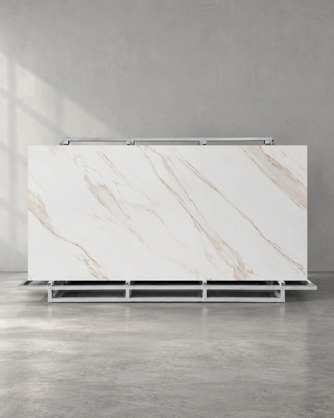 Gadal Fish Maw Gold full sintered stone slab on an A-frame with fine diagonal gold veins