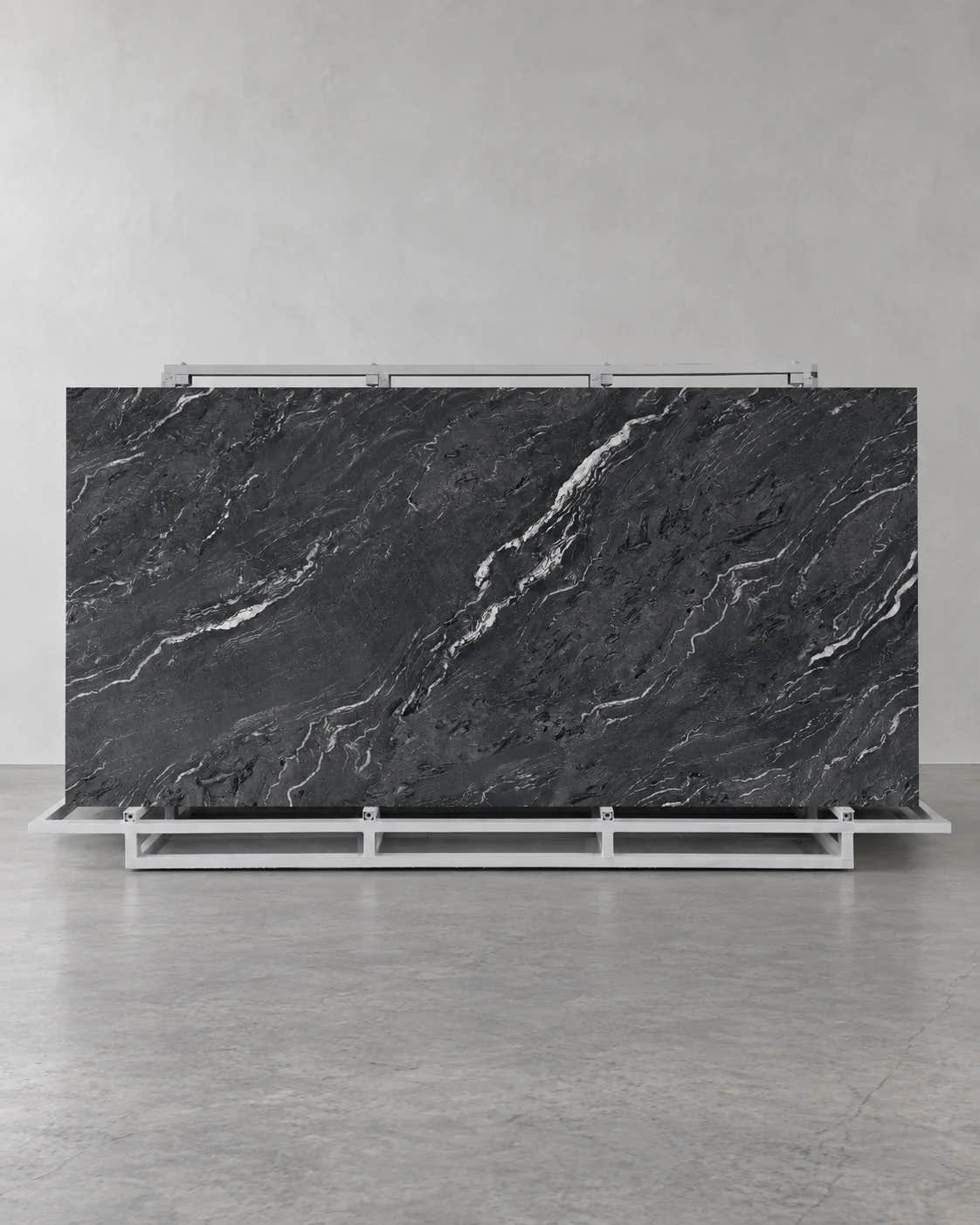 Gucci Black full sintered stone slab on an A-frame with flowing pale diagonal veins