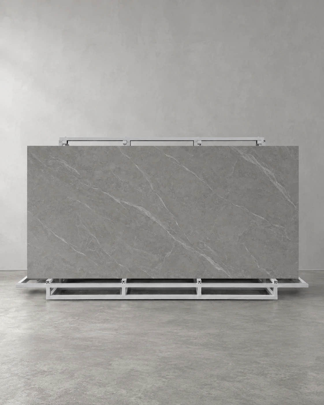 Lightning Grey full sintered stone slab on an A-frame with pale diagonal veining