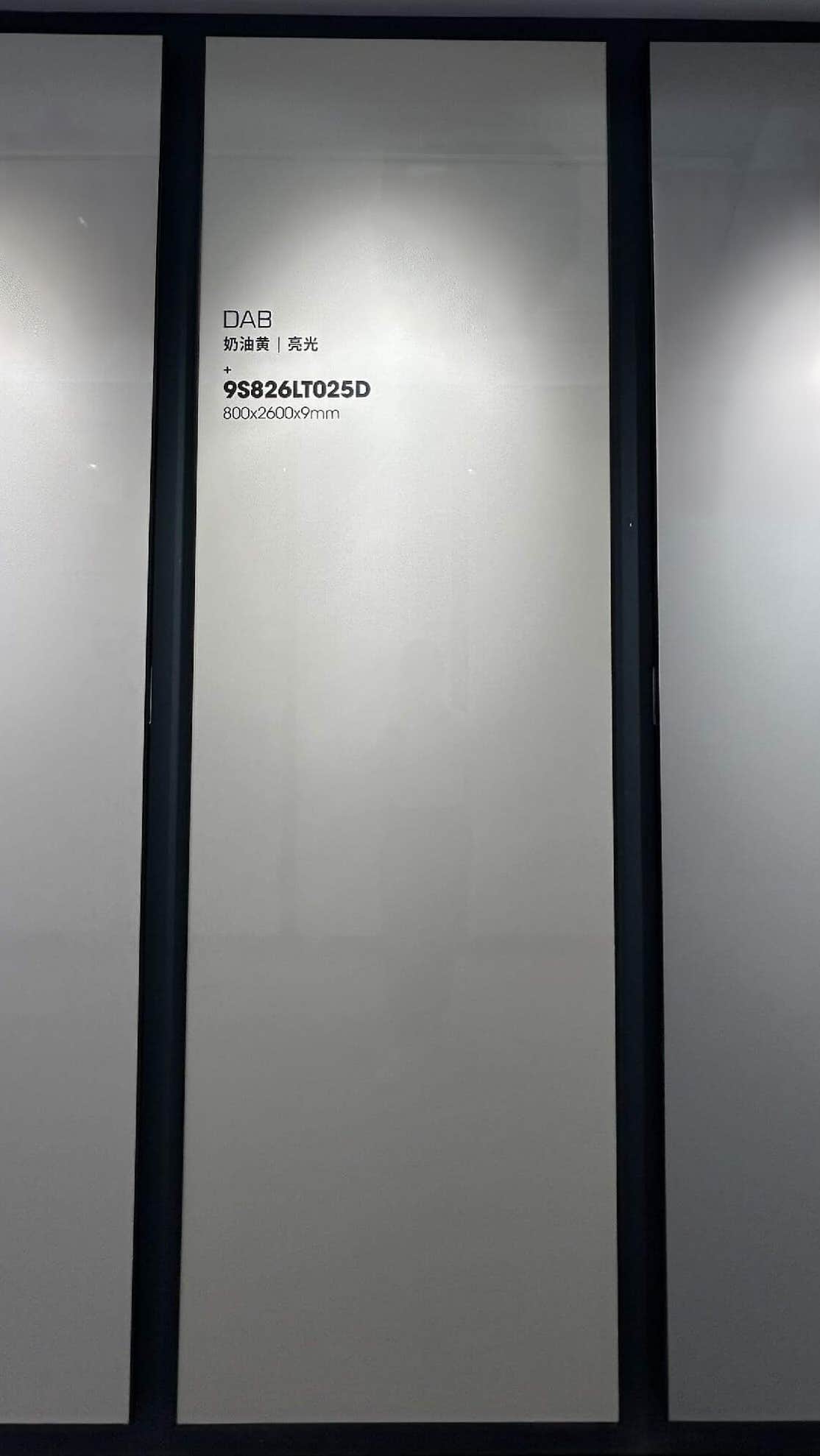 Oatmeal Cream sintered stone showroom display board with glossy slab label