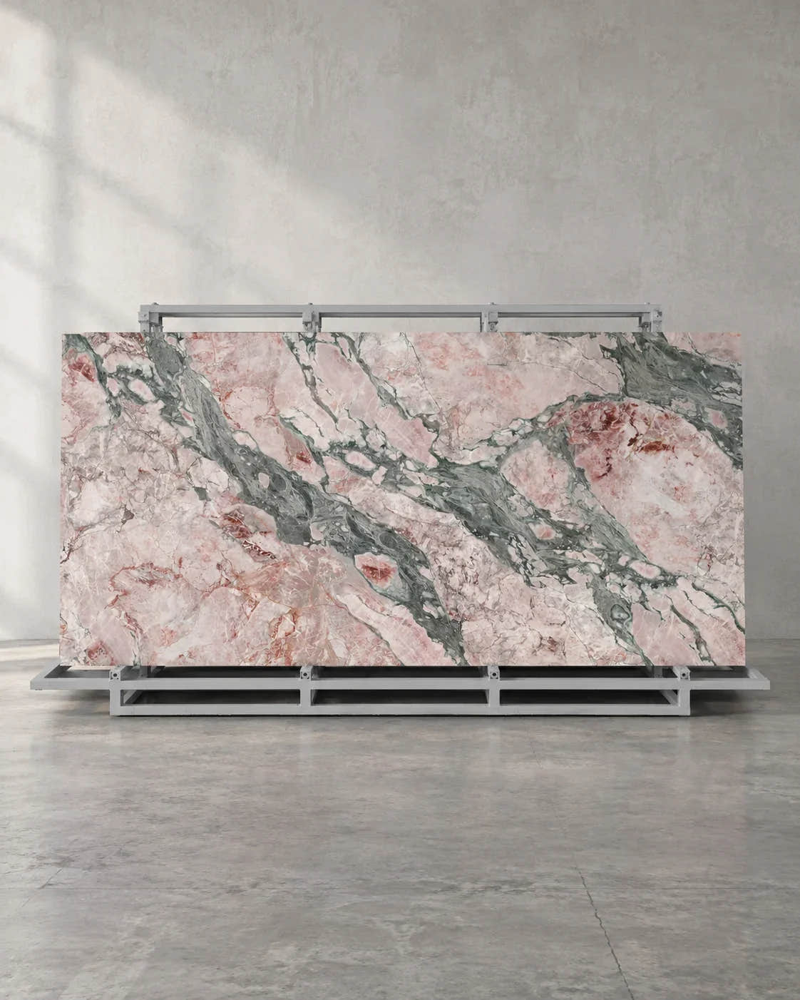 Seasons Pink full-body sintered stone slab and complete A-frame in a naturally framed showroom