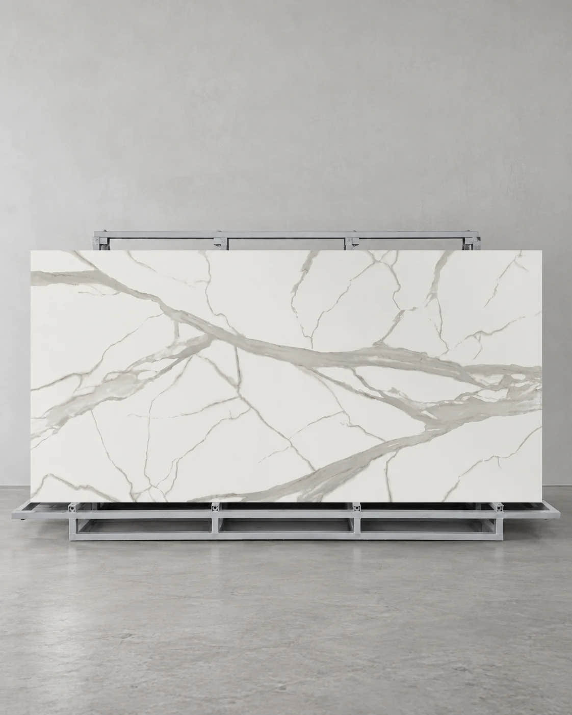 Super Snow White full slab with broad pale grey veins on a complete steel A-frame