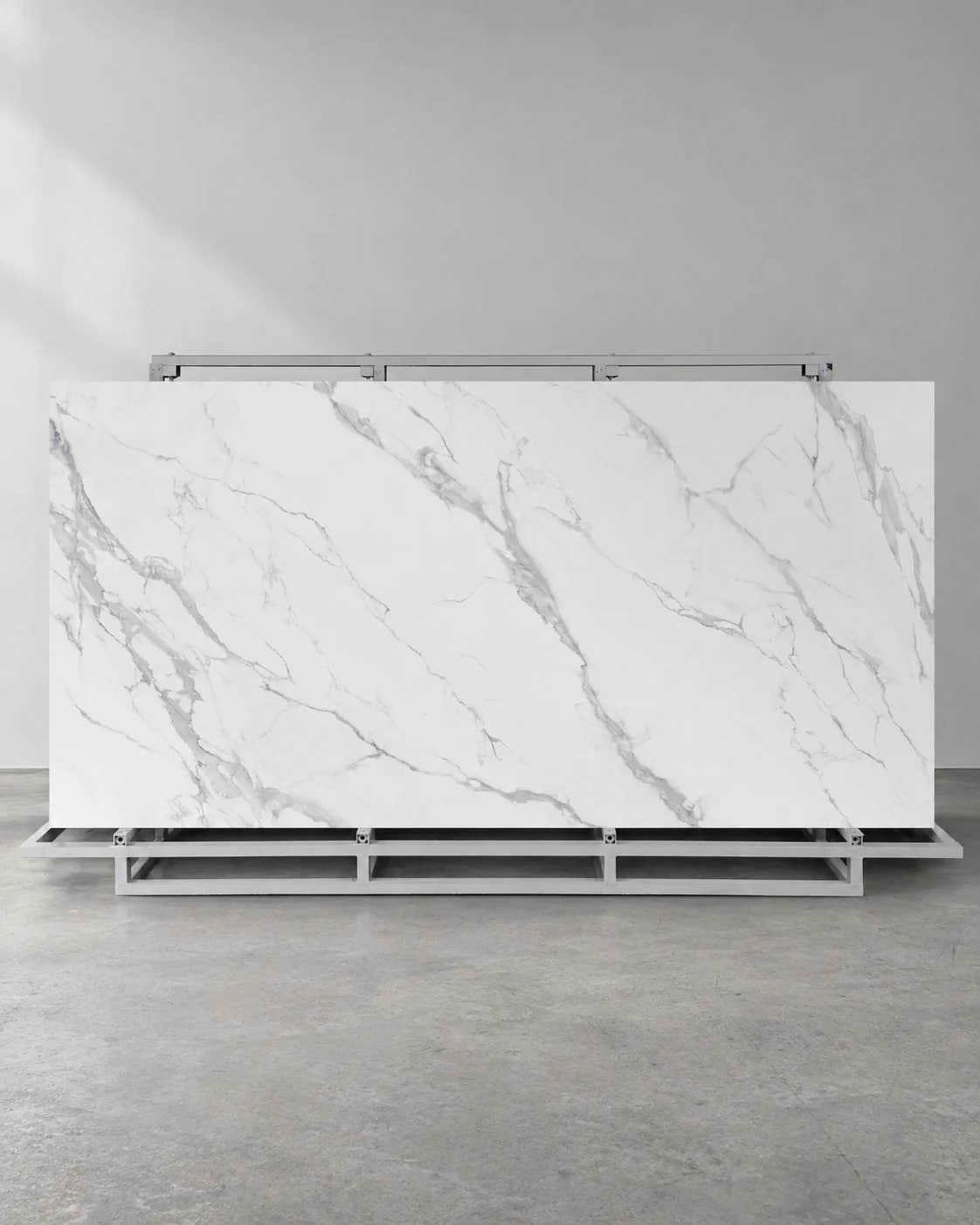 Waterfall white marble-look sintered stone slab with pale grey veins on a complete A-frame