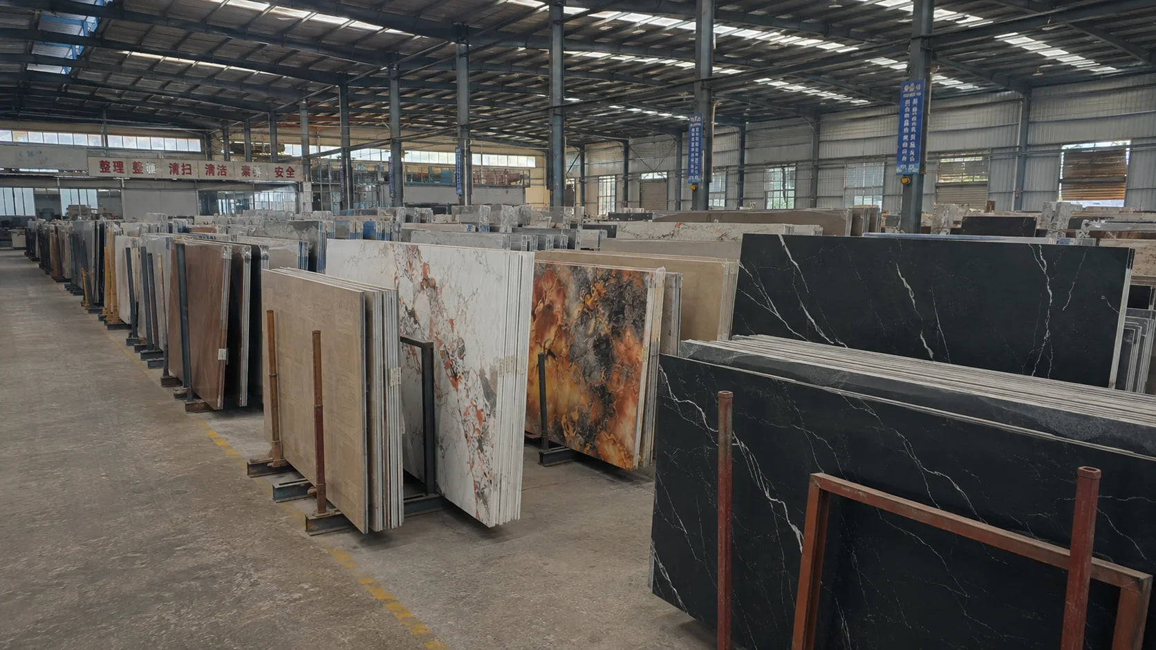 Sintered stone slab stock organised for furniture production and replenishment