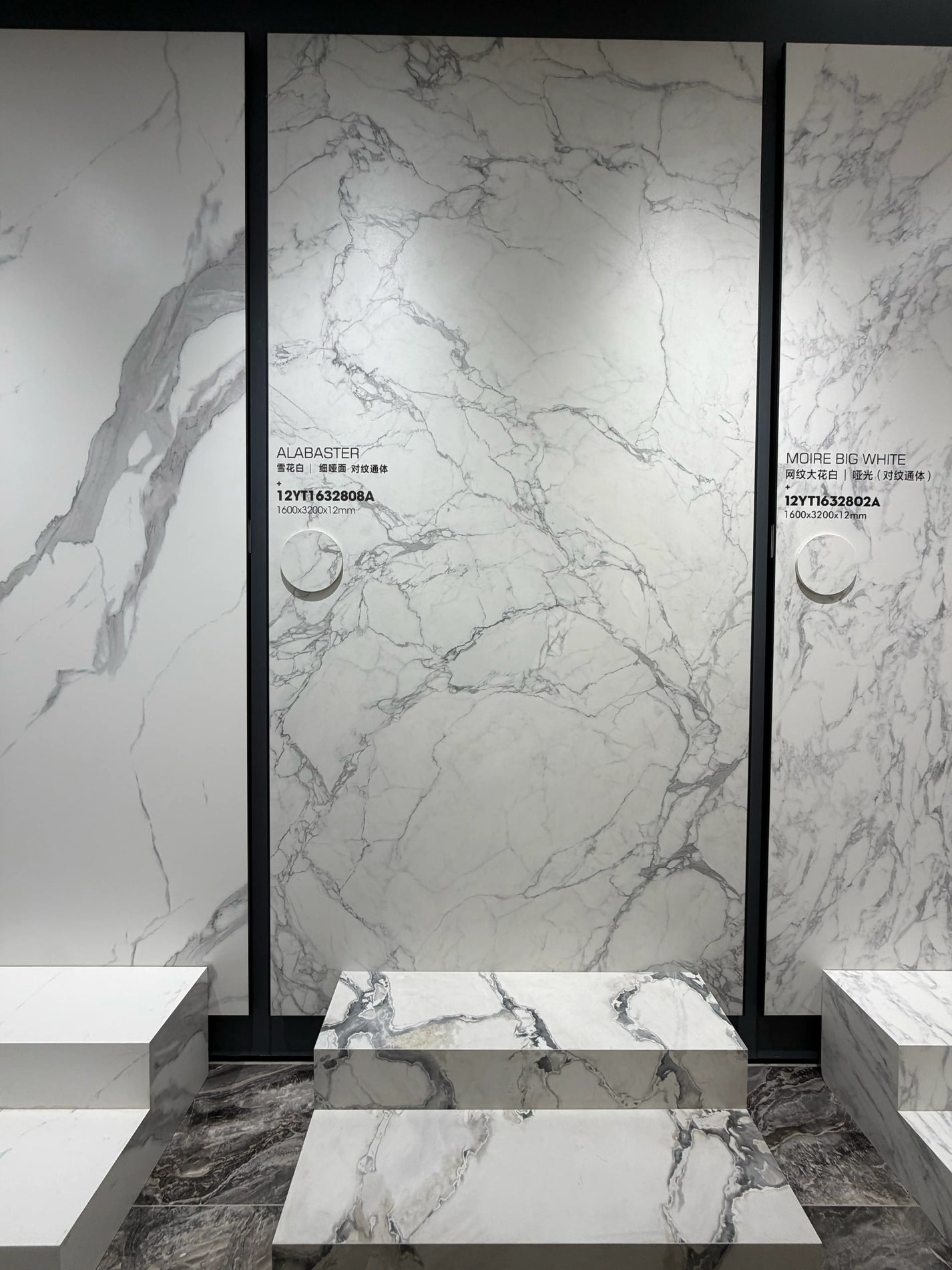 Wide showroom display of the Alabaster fine-matte white slab