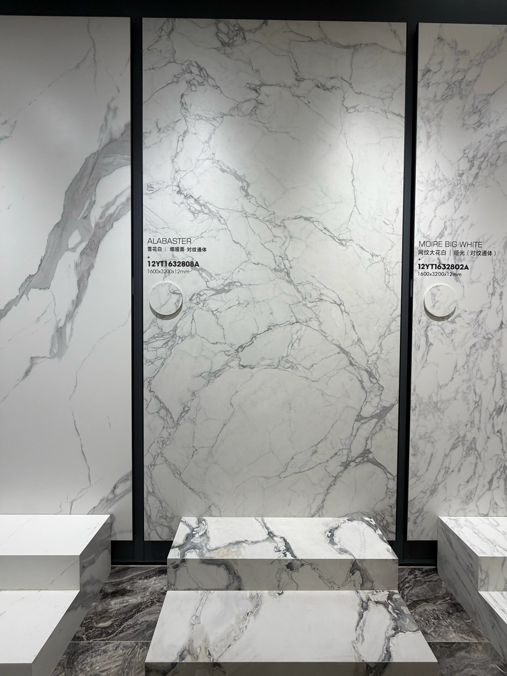 Wide showroom display of the Alabaster fine-matte white slab