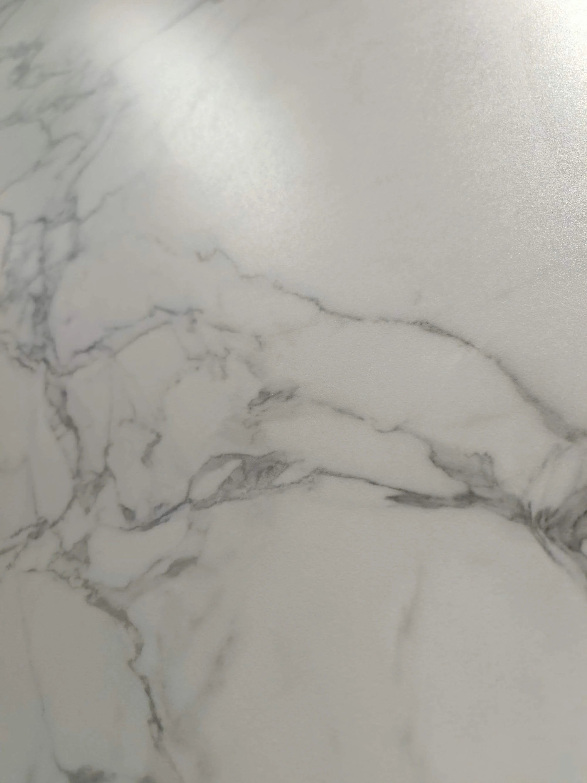 Soft cloudy white area within the Alabaster fine-matte pattern