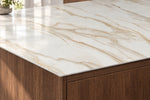 Alice Gold full-body sintered stone countertop with a slim 12 mm edge above walnut cabinetry