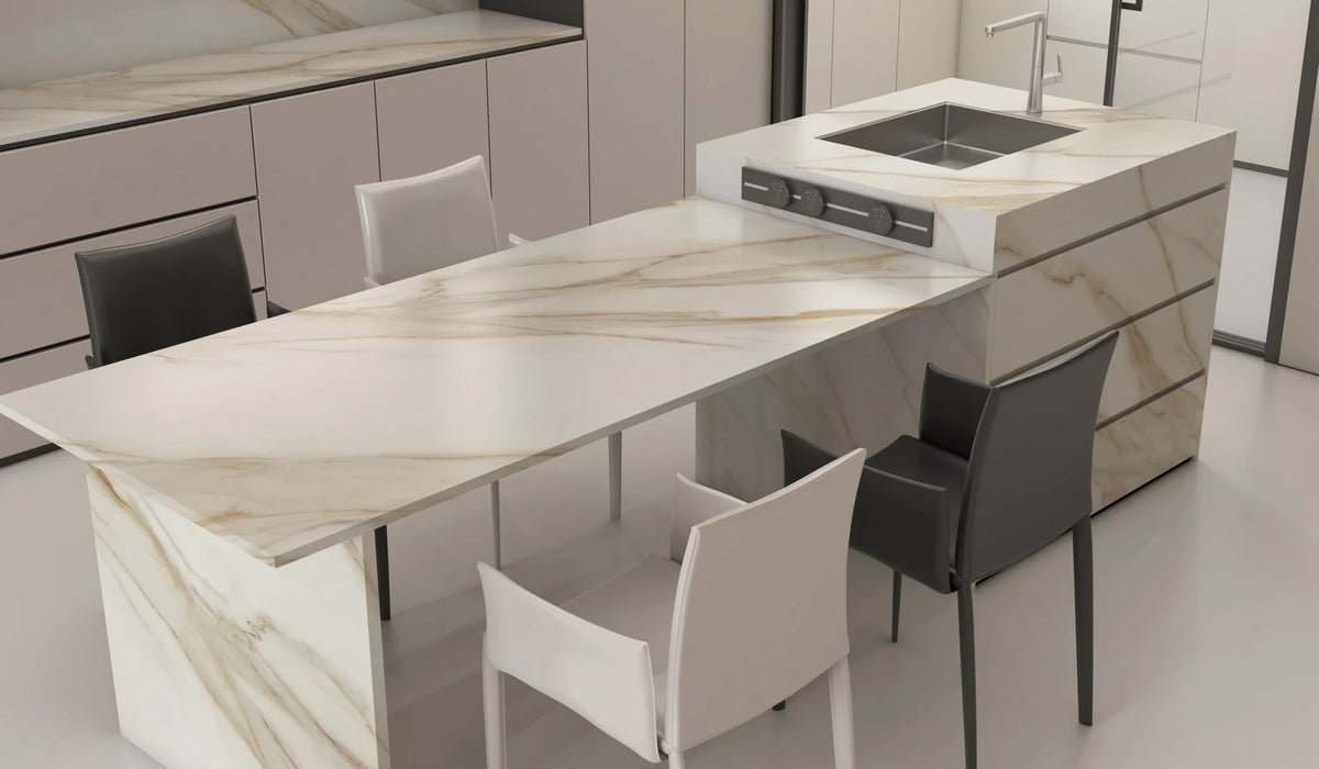 Alice Gold full-body sintered stone dining island countertop and cabinet panels in a pale kitchen