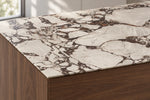 Boutique Bvlgari Purple sintered stone countertop with a thin 12mm edge above walnut cabinetry