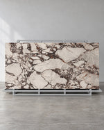 Boutique Bvlgari Purple sintered stone slab with ivory fragments and dark veins on a complete A-frame