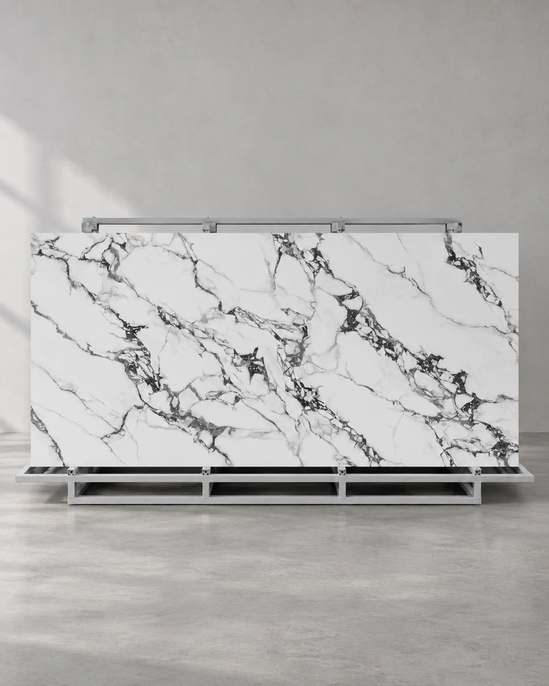 Bvlgari Black full sintered stone slab on an A-frame with white and charcoal breccia veining