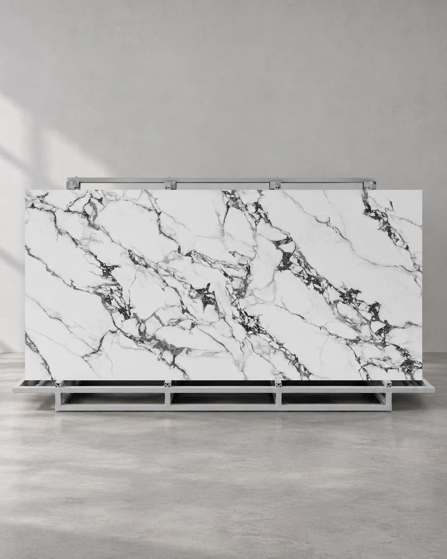 Bvlgari Black full sintered stone slab on an A-frame with white and charcoal breccia veining