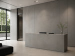 Cool Gray sintered stone used as modern lobby wall panels and reception counter