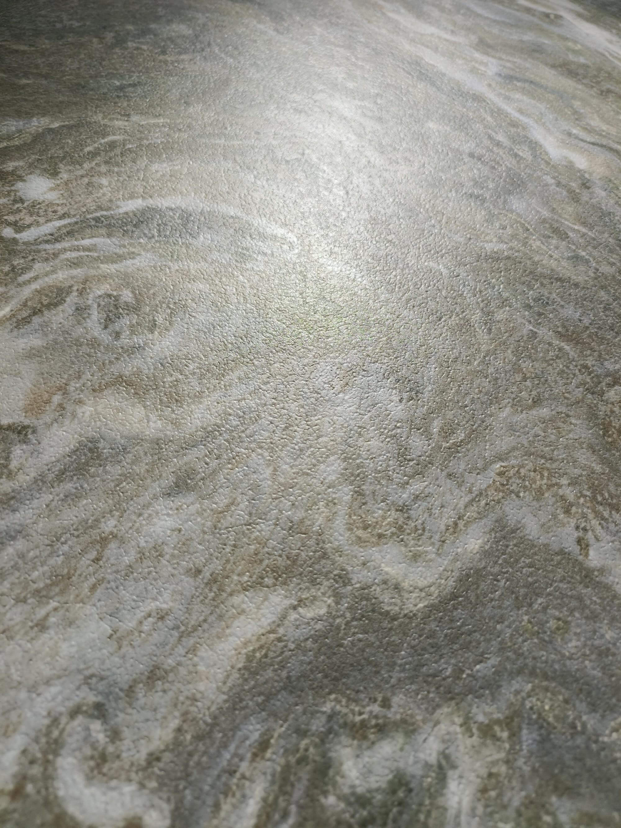 Low-angle surface detail showing soft white ribbons and tactile low-sheen texture