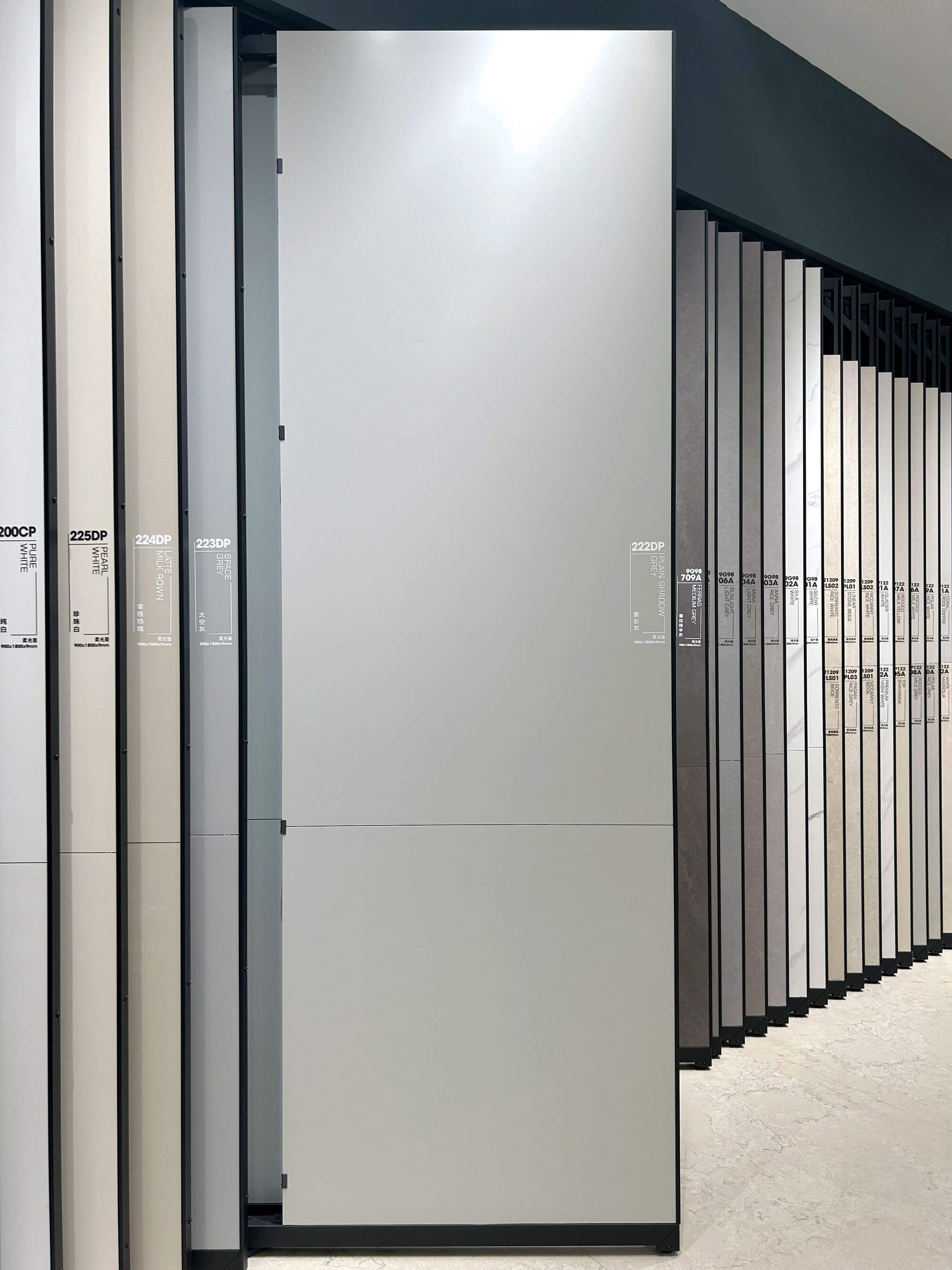 Dove gray sintered stone slab shown on a showroom display rack