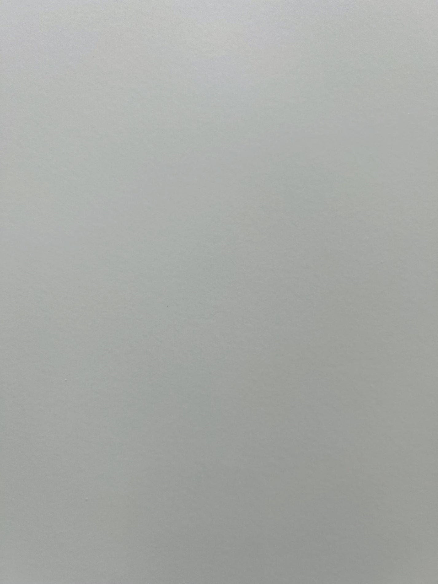 Close view of dove gray sintered stone with soft cloudy variation