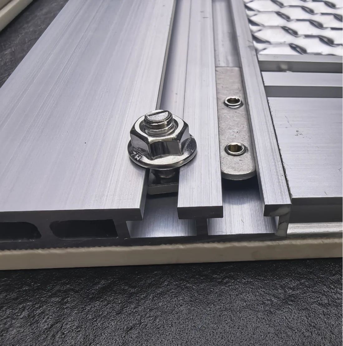 Stainless fastener, locking washer and aluminum facade profile detail