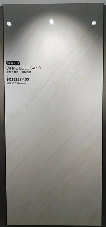 Large white marble-look slab displayed vertically in a showroom frame