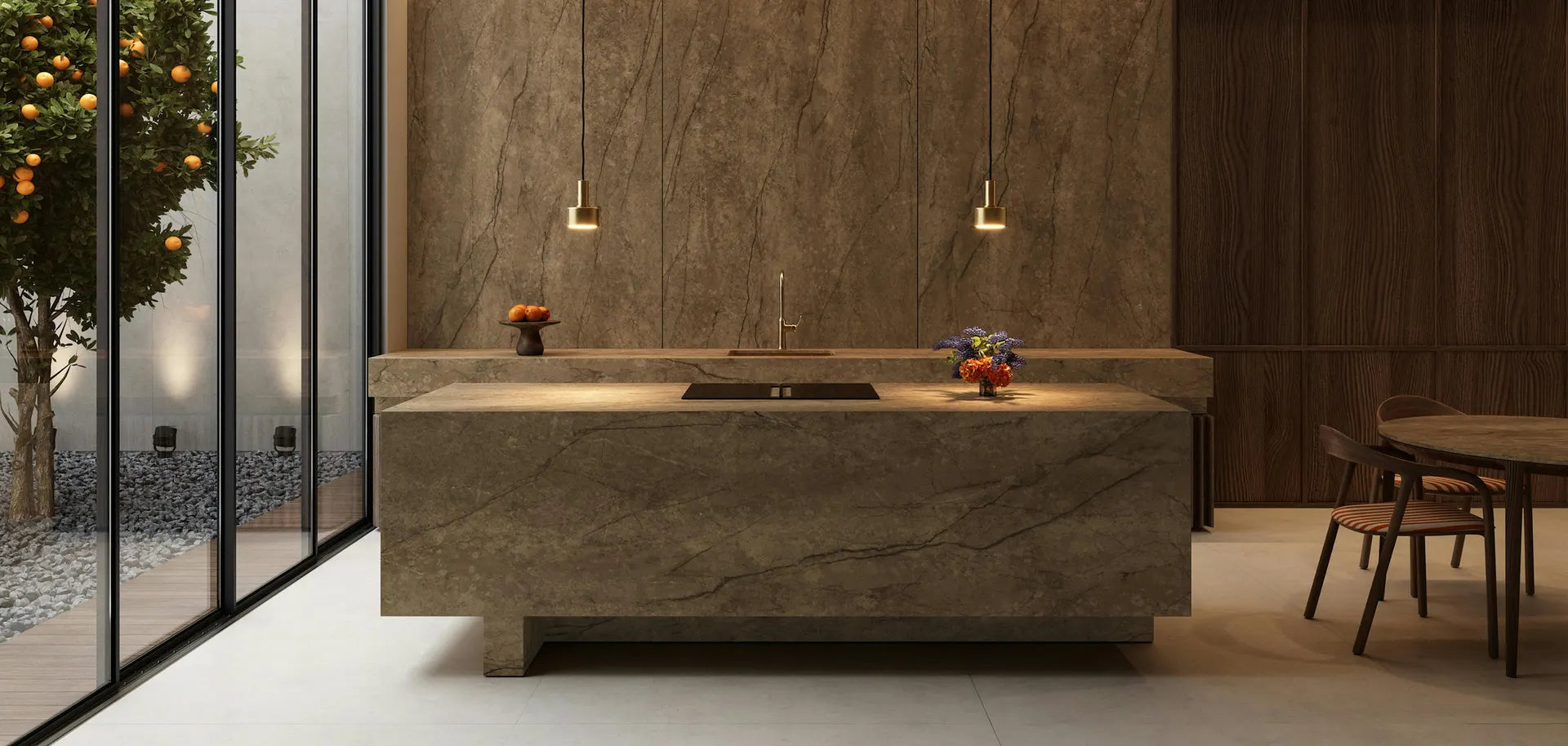 Sintered stone kitchen island and matching wall panels in a modern dining space