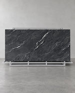 Gucci Black full sintered stone slab on an A-frame with flowing pale diagonal veins