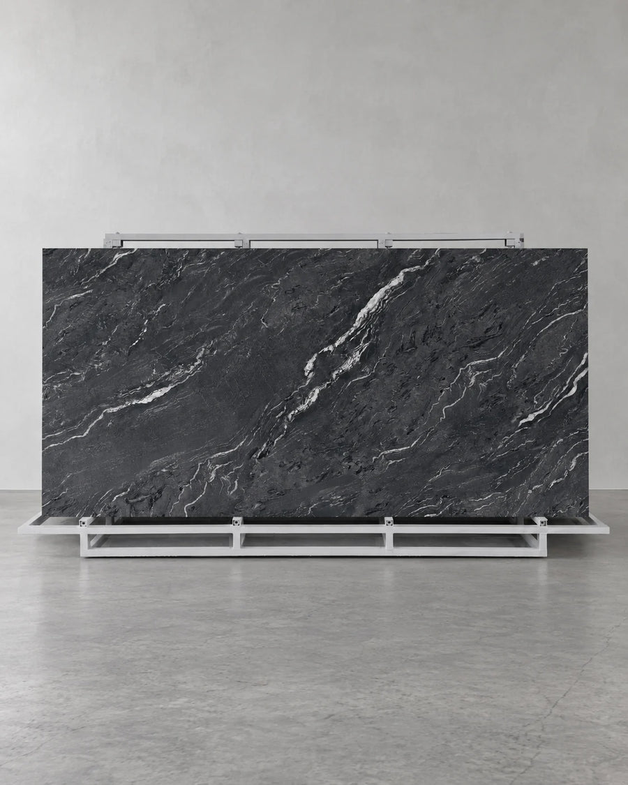 Gucci Black full sintered stone slab on an A-frame with flowing pale diagonal veins
