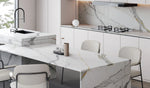 Italy Fish Maw White sintered stone island countertop and splashback in a pale kitchen
