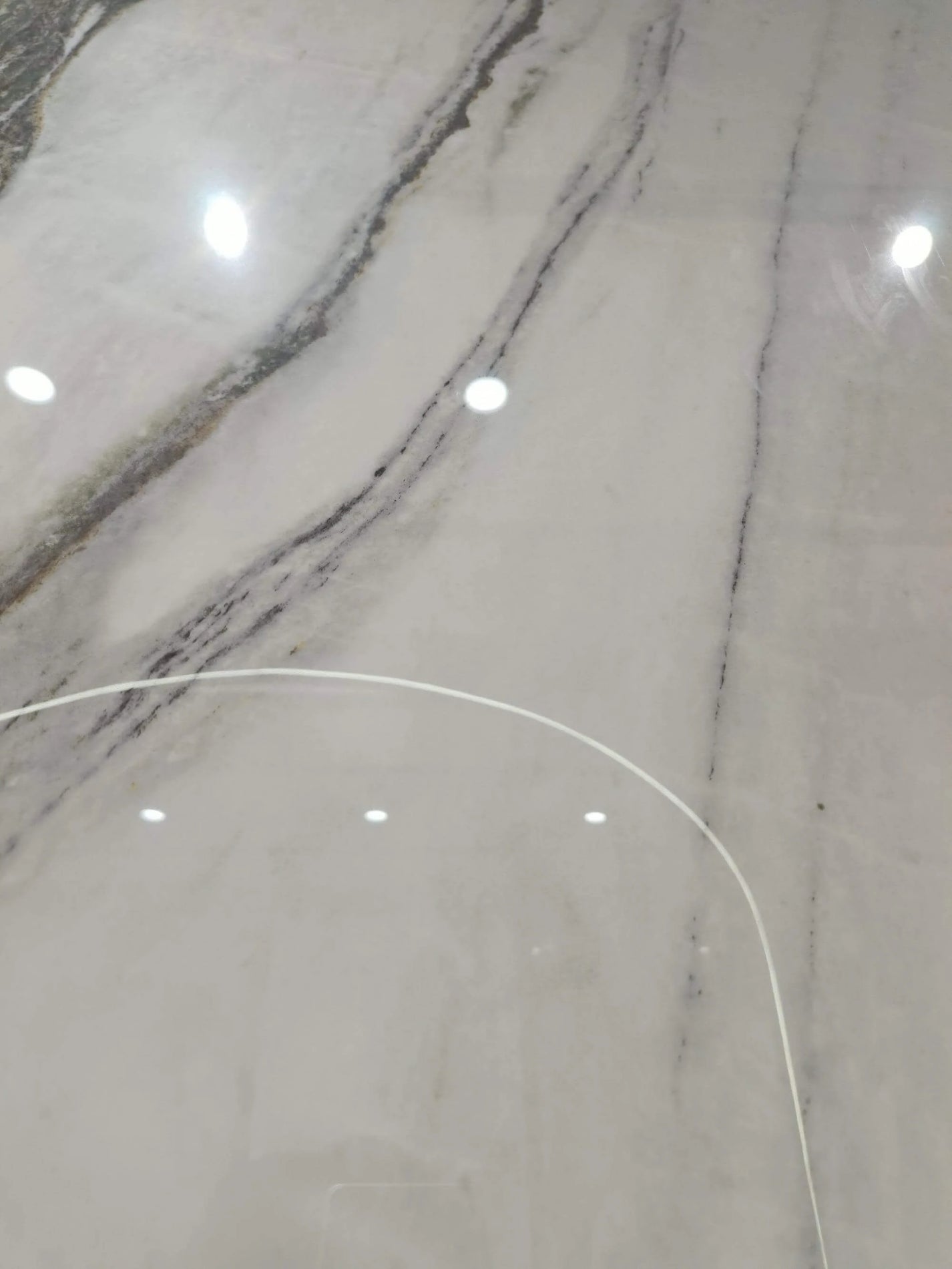 Fine graphite veining across the pale area of Lanshan Songcui