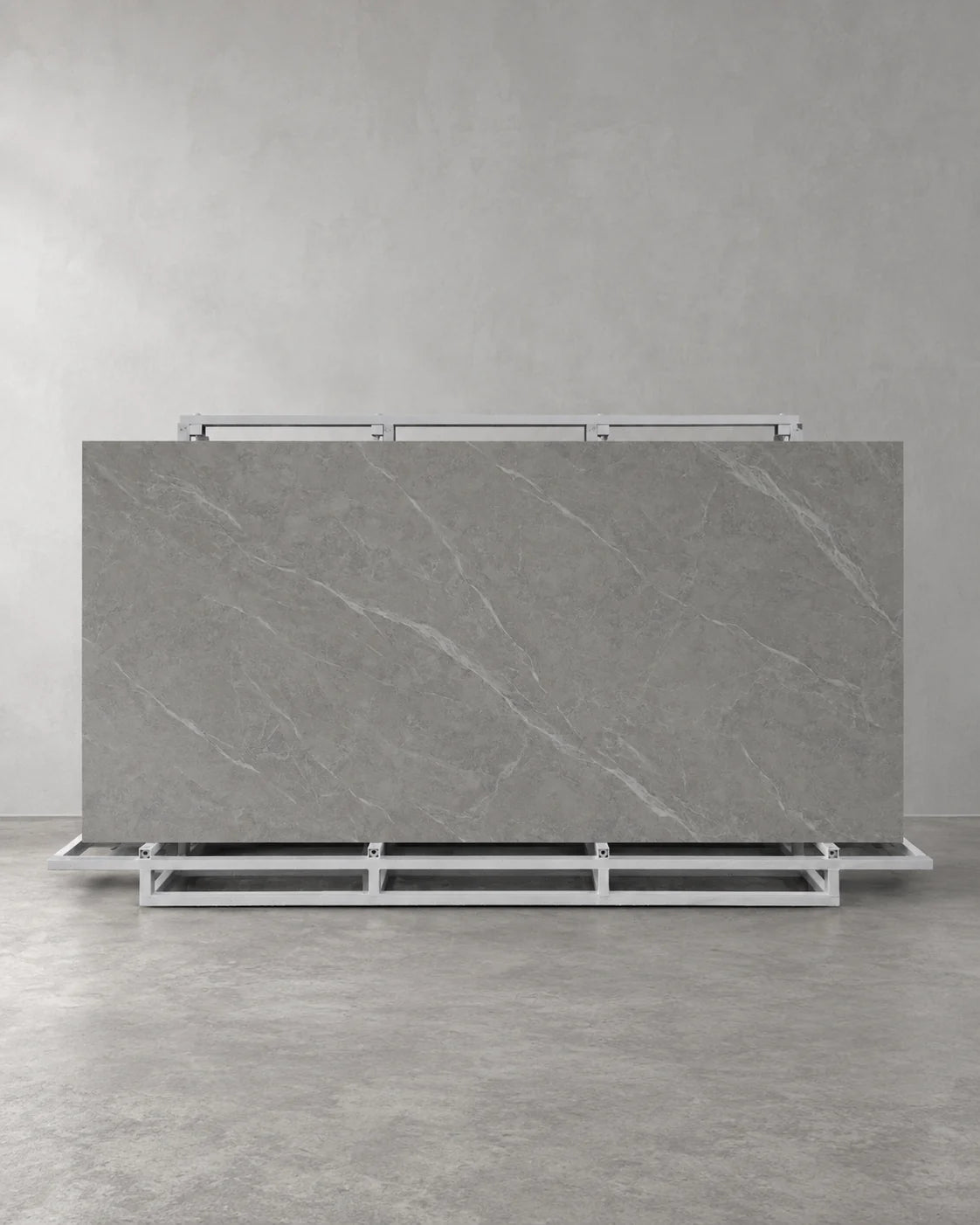 Lightning Grey full sintered stone slab on an A-frame with pale diagonal veining