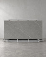 Lightning Grey full sintered stone slab on an A-frame with pale diagonal veining