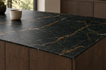 Nero Portoro sintered stone countertop with a visible slim 12 mm edge and fine gold veins