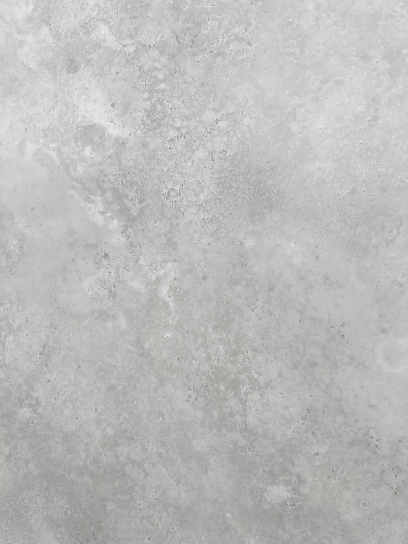 Close-up of New Lime sintered stone slab showing grey stone movement