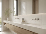 Pearl White glossy sintered stone used on a modern bathroom vanity and wall panels