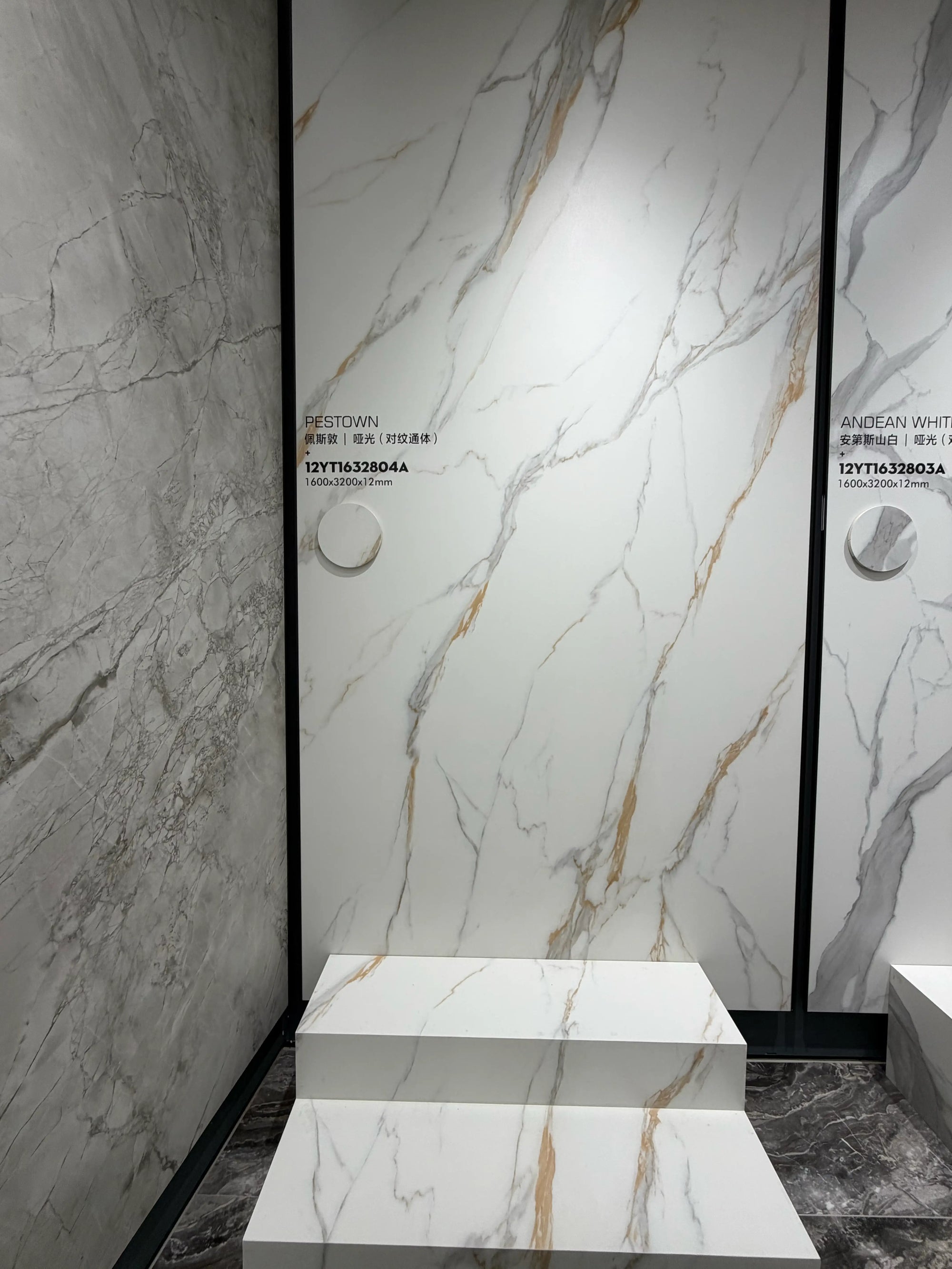 Pestown matte white and gold-veined slab displayed in the showroom
