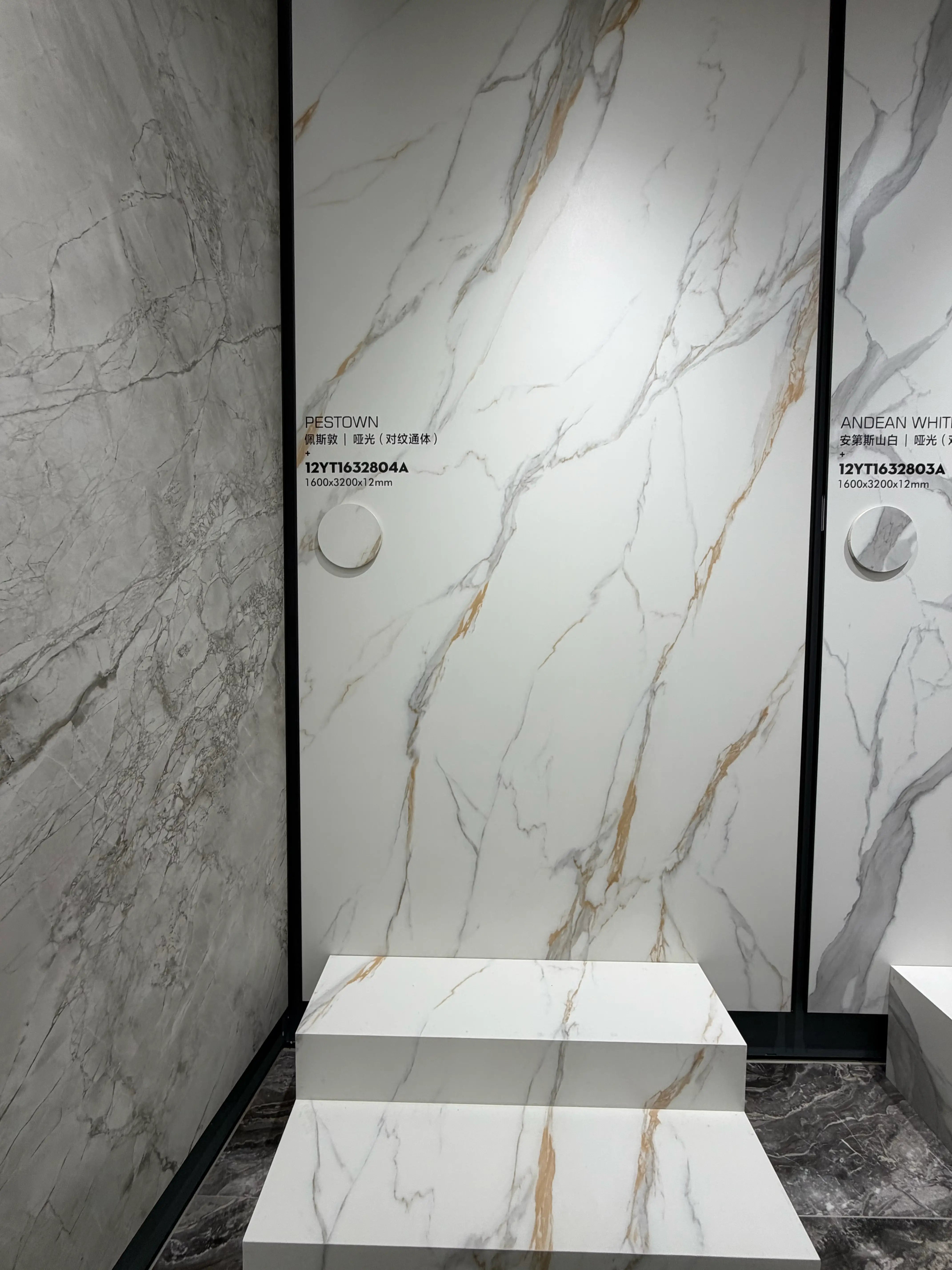 Pestown matte white and gold-veined slab displayed in the showroom
