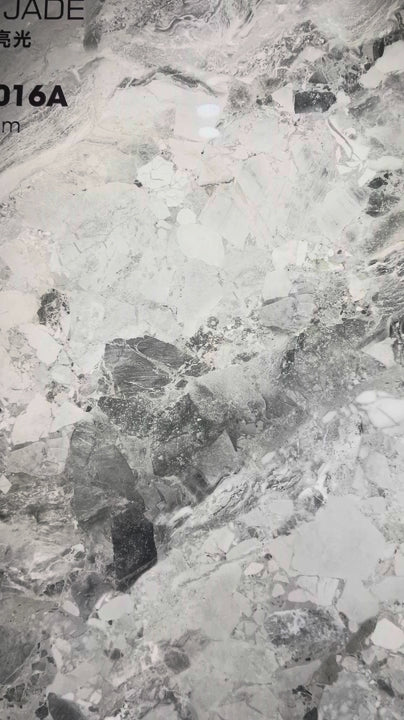 Video close-up of the polished Sicilian Jade sintered stone surface and showroom slab