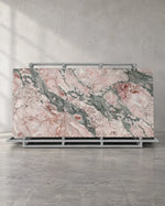 Seasons Pink full-body sintered stone slab and complete A-frame in a naturally framed showroom