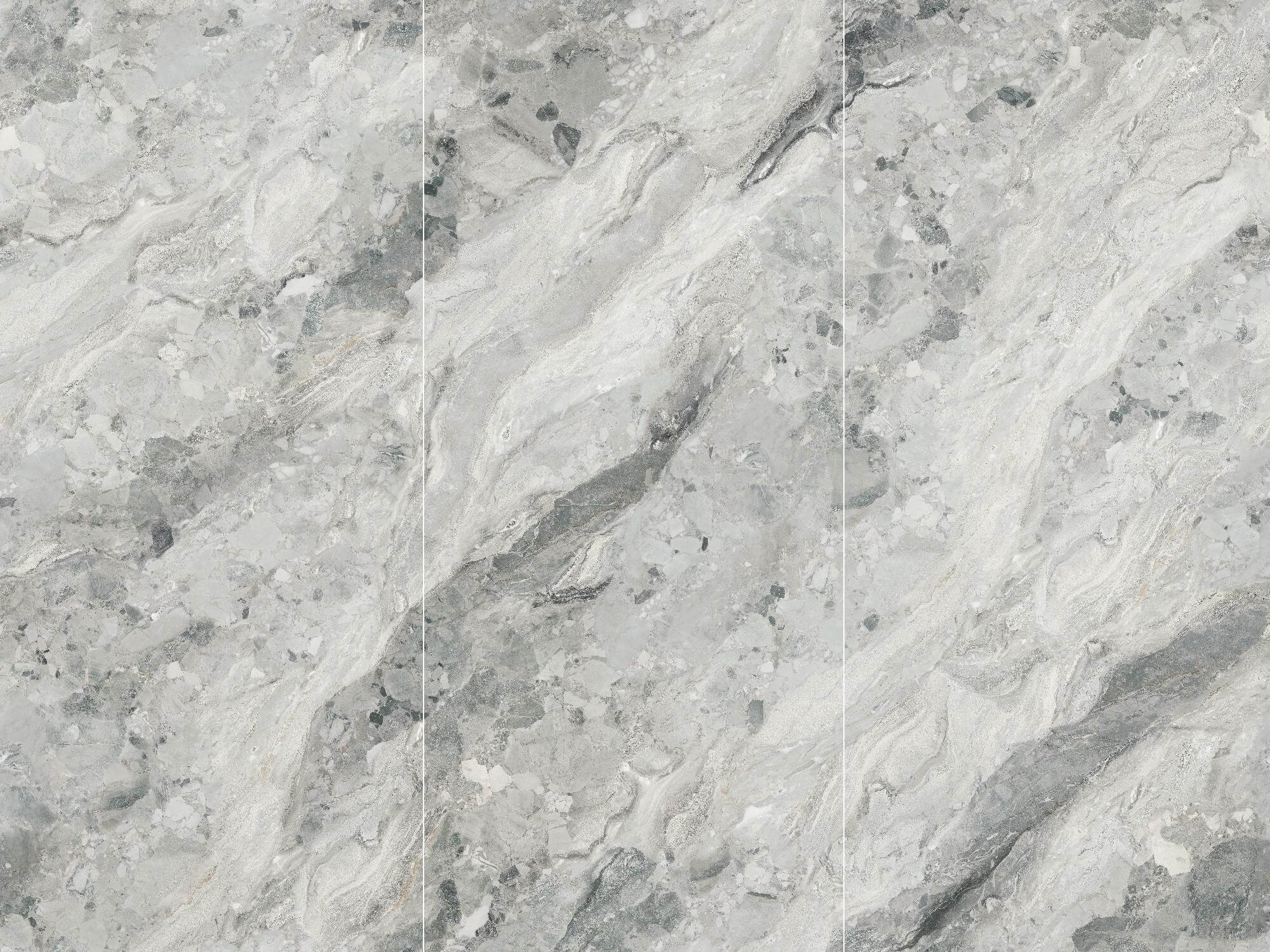 Three coordinated Sicilian Jade sintered stone faces with white and grey brecciated movement