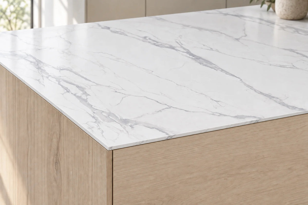 Waterfall sintered stone countertop showing a thin 12mm edge and pale grey veining
