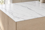 Waterfall sintered stone countertop showing a thin 12mm edge and pale grey veining