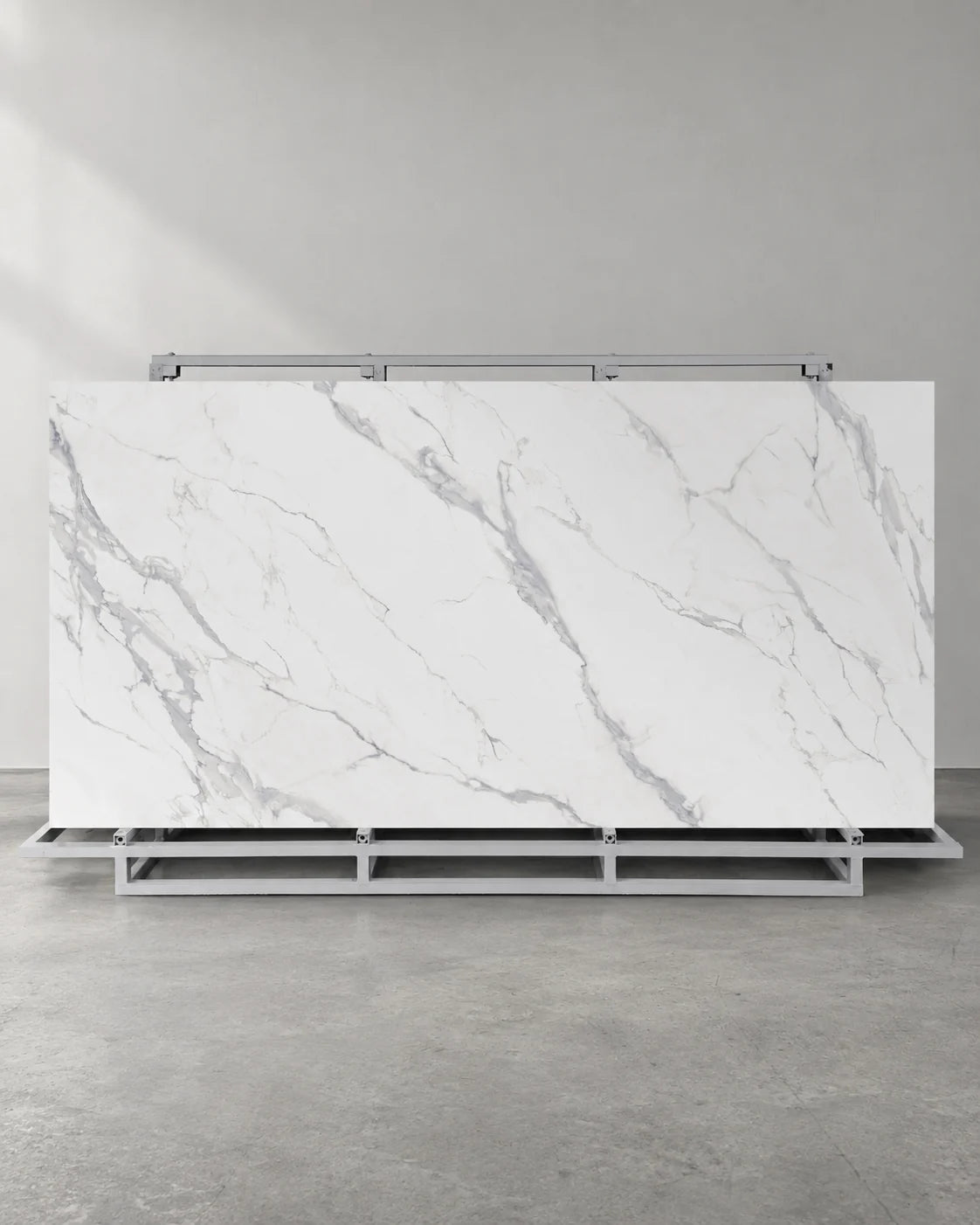 Waterfall white marble-look sintered stone slab with pale grey veins on a complete A-frame