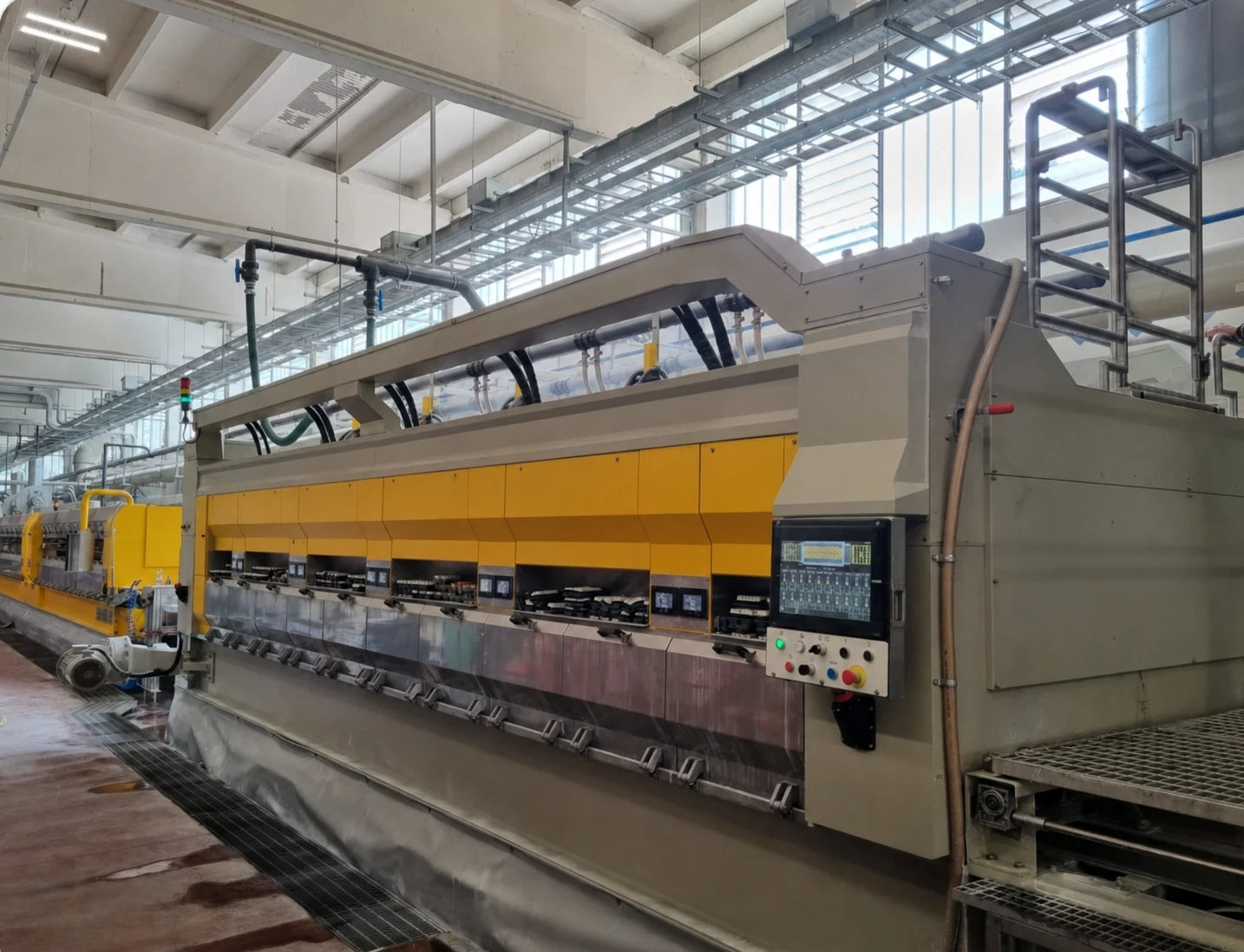 Automated equipment polishing a slab surface and finishing its edges