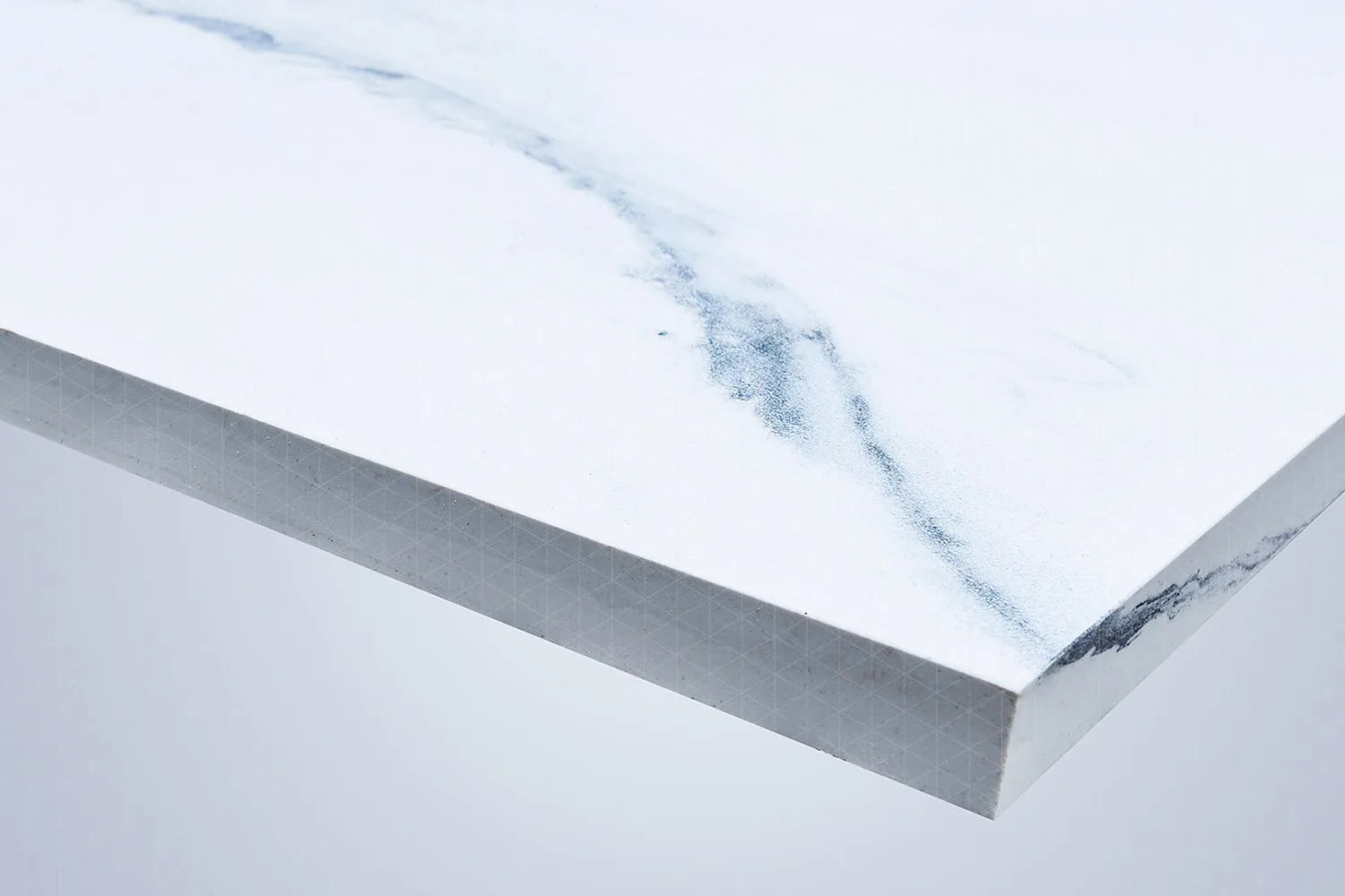 Full-body sintered stone slab with pattern visible through the cut edge